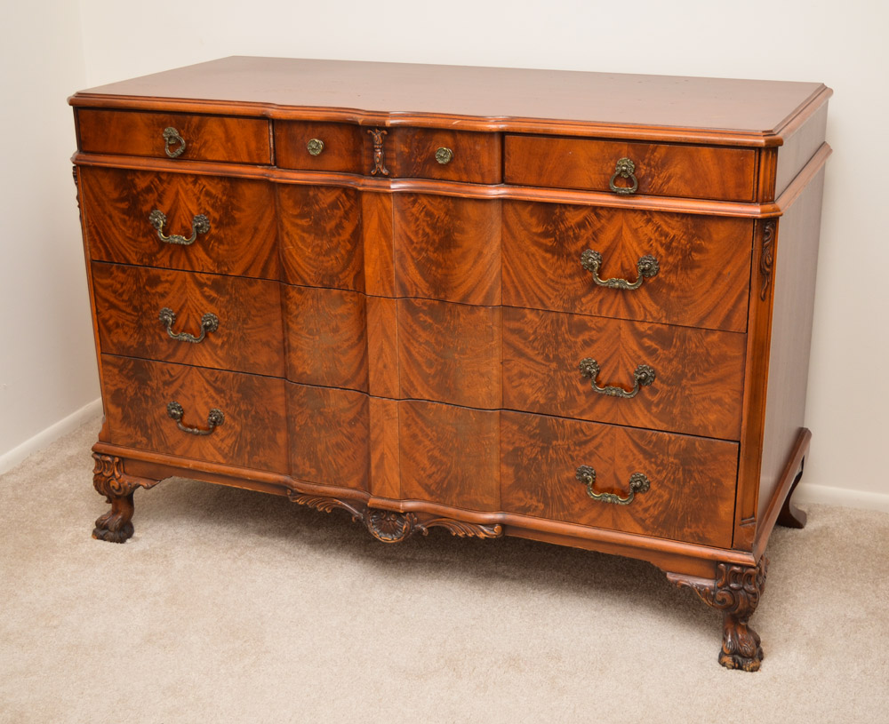 Appraisal: CROTCH GRAIN MAHOGANY CHEST OF DRAWERS Shaped top and front