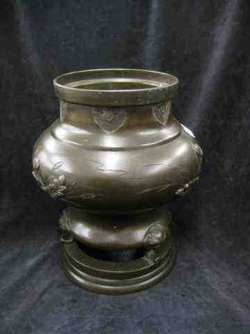 Appraisal: Japanese Bronze Planter bird foliage design tri-footed ring base ''