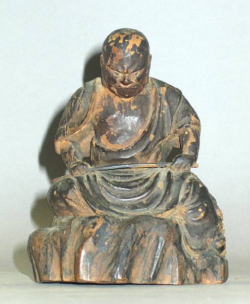 Appraisal: A lacquered wood figure of a seated rakan Edo Period