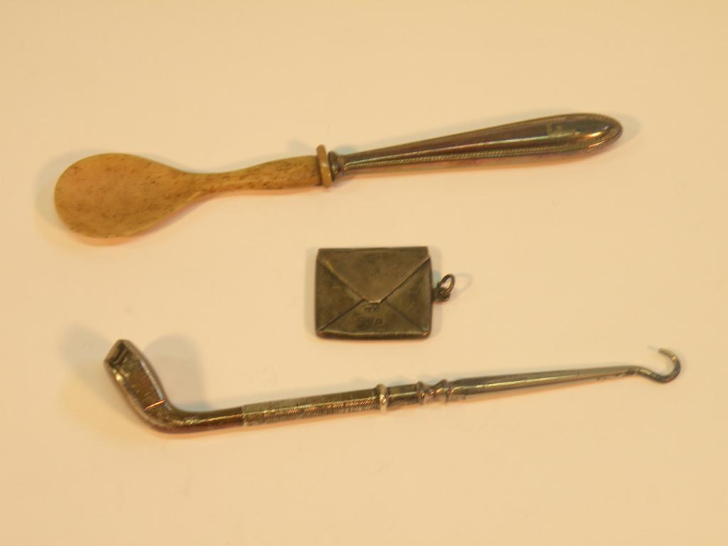 Appraisal: A novelty silver button hook in the form of a