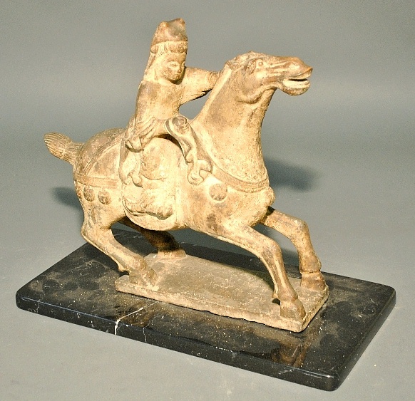 Appraisal: - Chinese Han style carved stone horse rider mounted on