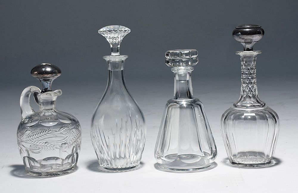 Appraisal: Four cut glass decanters Four cut glass decanters two Baccarat