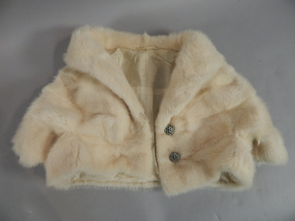 Appraisal: A white fur short bolero jacket with retailers box for