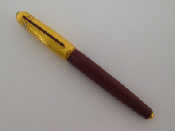 Appraisal: CARTIER Pasha a burgundy and rolled gold fine liner pen