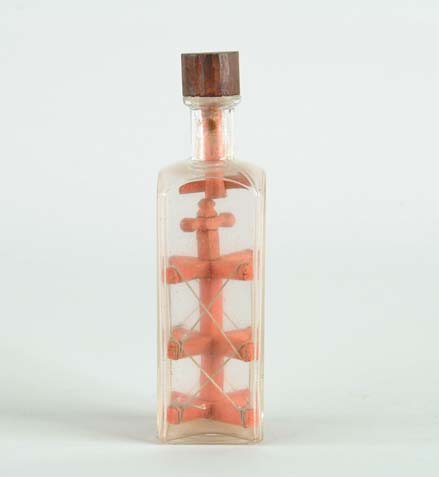 Appraisal: EARLY WOOD AND BOTTLE WHIMSEY Clear square bottle with cylinder