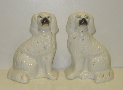 Appraisal: PAIR STAFFORDSHIRE DOGS White seated spaniels with black muzzles and