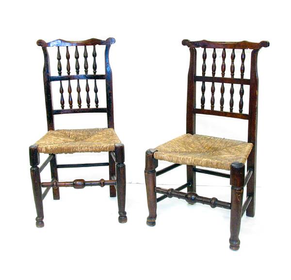 Appraisal: A set of four English beechwood and rush seat spindleback