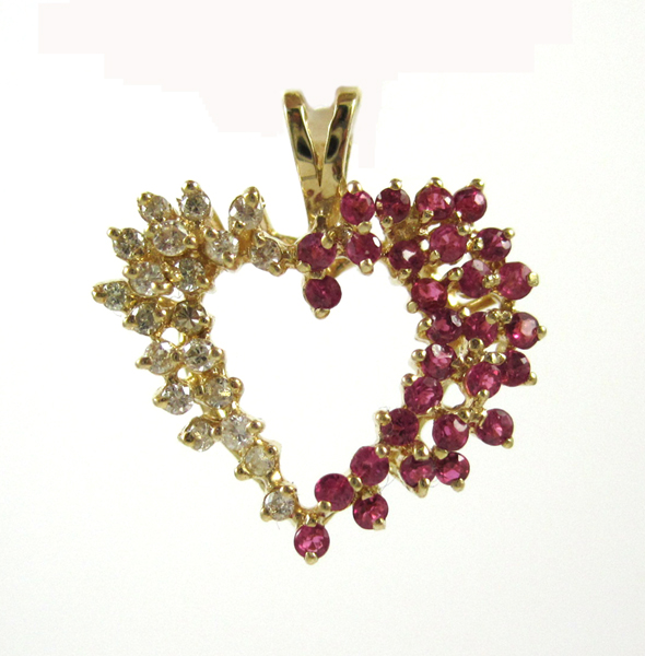 Appraisal: RUBY DIAMOND AND FOURTEEN KARAT GOLD PENDANT The yellow gold