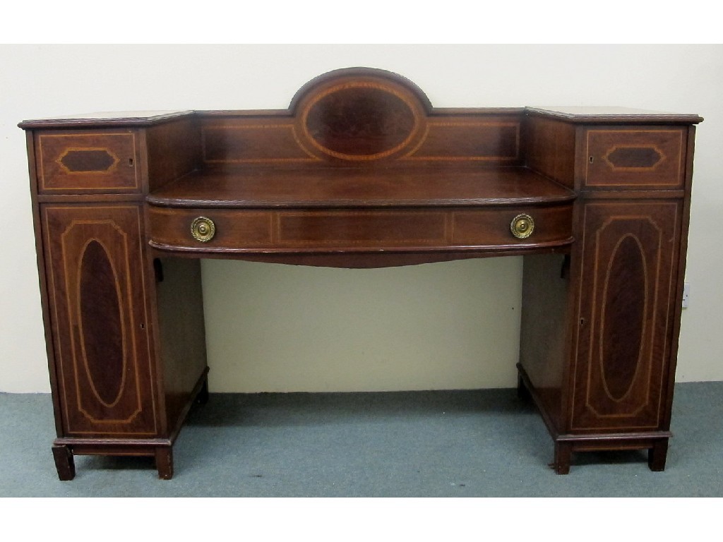 Appraisal: An Edwardian mahogany inlaid sideboard in the Sheraton style of