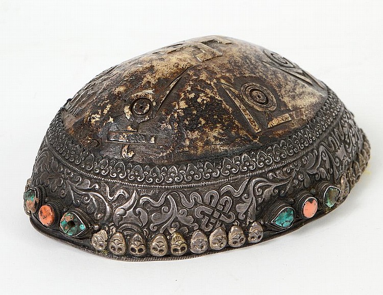 Appraisal: TIBETAN MINERAL AND SILVER MOUNTED SKULL CAPPre- The bone carved