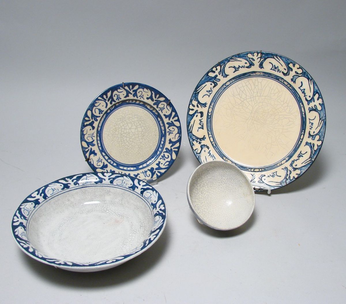 Appraisal: FOUR PIECES OF DEDHAM POTTERY Plate in Rabbit pattern diameter