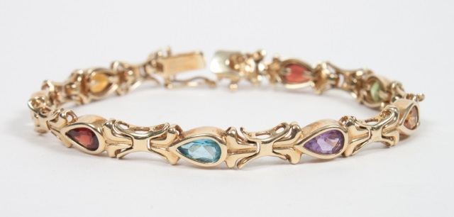 Appraisal: Lady's K gold and colored stone bracelet featuring pear-shaped colored