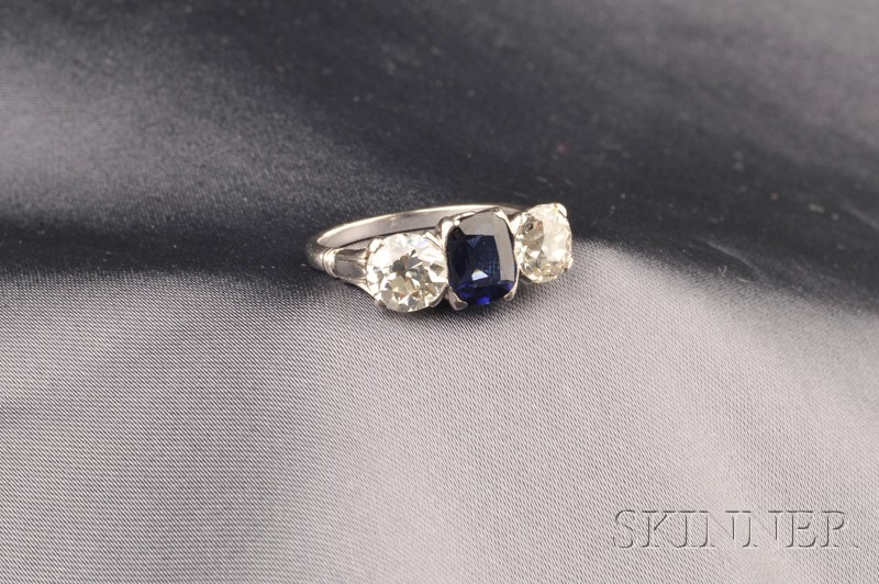 Appraisal: Platinum Synthetic Sapphire and Diamond Ring centering a cushion-cut sapphire