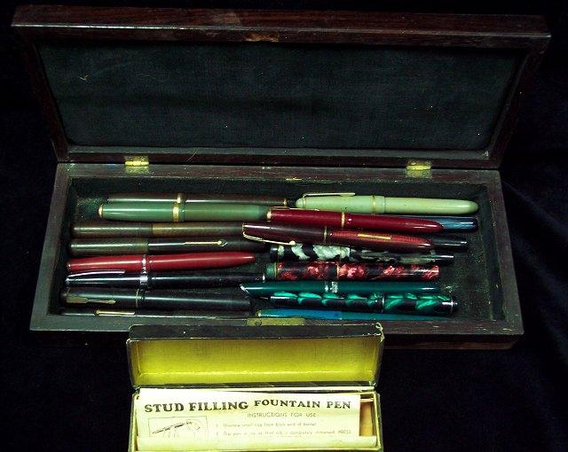 Appraisal: A rectangular rosewood box containing a quantity of fountain pens