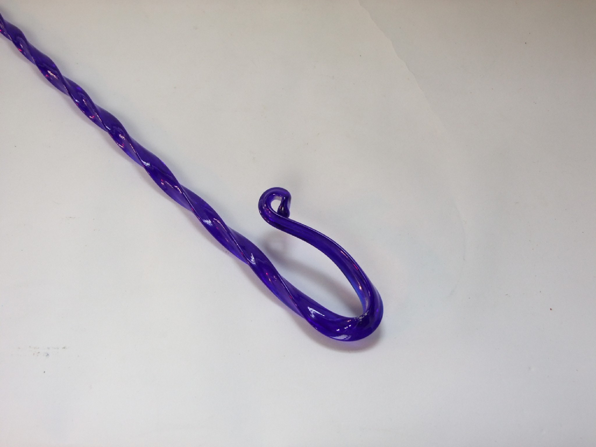 Appraisal: A cobalt blue glass cane with crooked handle and twisted