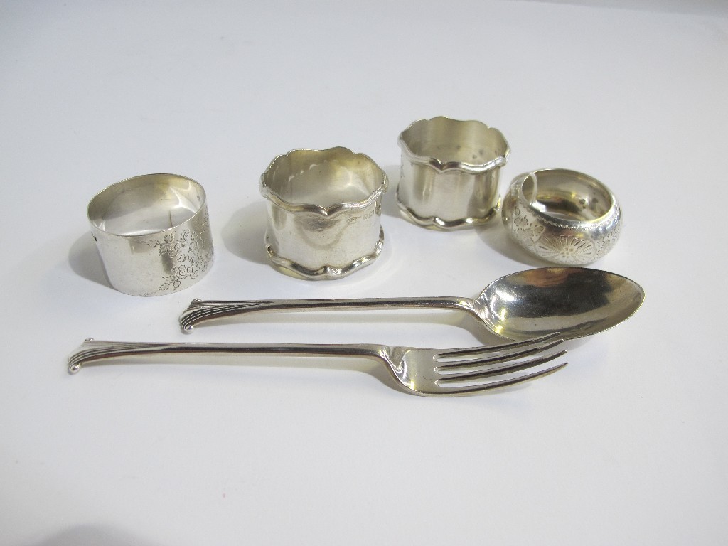 Appraisal: A lot comprising a pair of silver napkin rings two