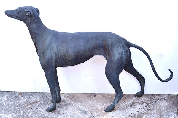 Appraisal: A PAIR OF BRONZE HOUNDSeach standing animal naturalistically formed the