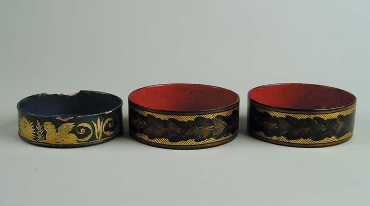 Appraisal: THREE DECORATED LACQUERWARE WINE COASTERS Lot consists of a -