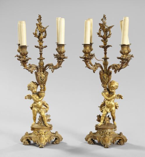 Appraisal: Pair of French Bronze Four-Light Putto Candelabra fourth quarter th