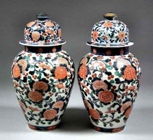 Appraisal: A pair of Japanese porcelain 'Imari' baluster shaped vases and