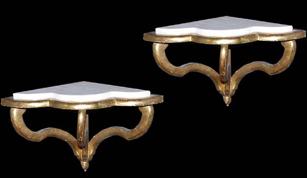 Appraisal: A pair of Italian giltwood marble topped corner brackets height