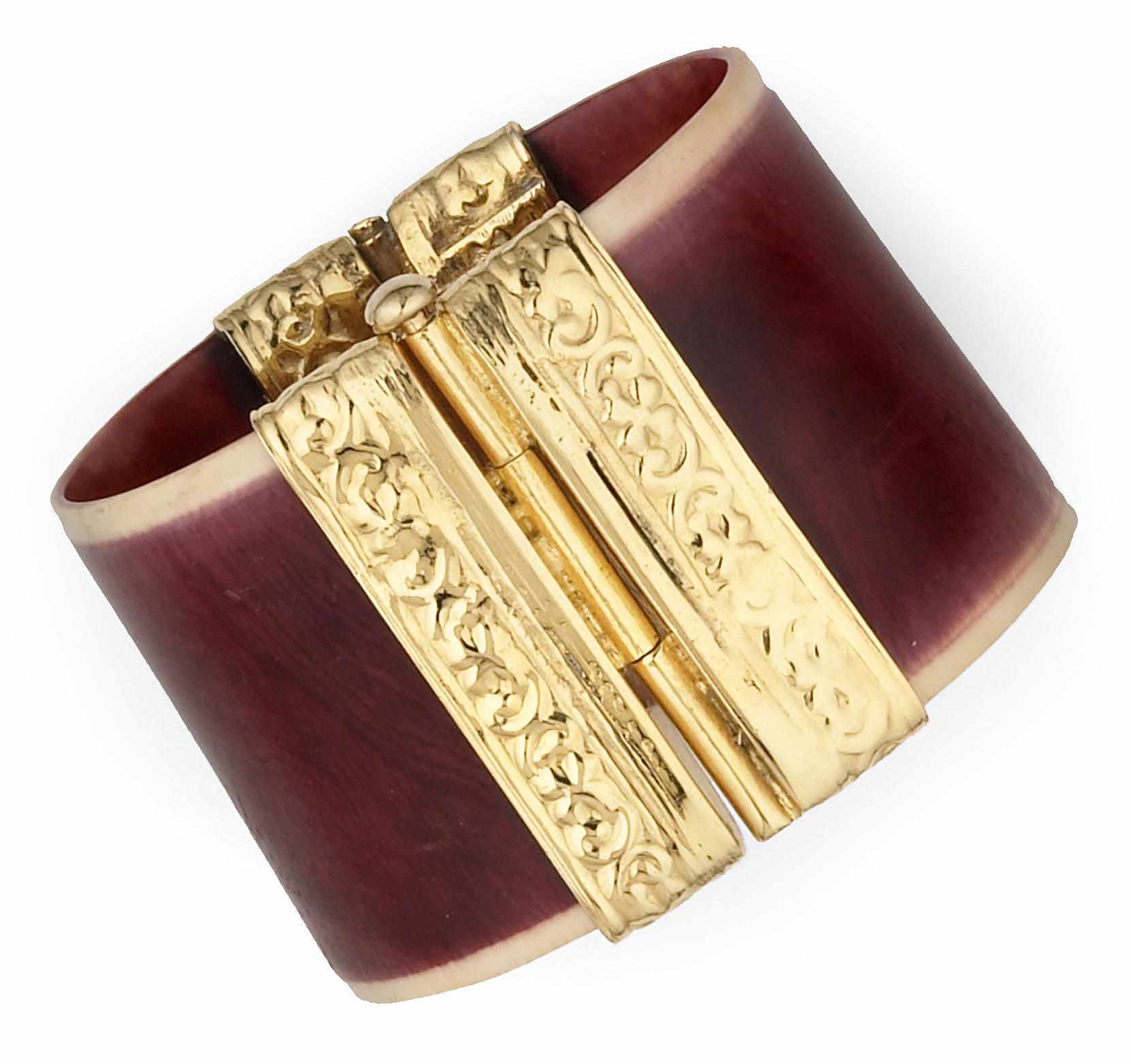 Appraisal: A bone and gold plated metal bracelet