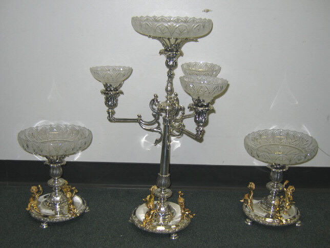 Appraisal: THREE-PIECE PLATED SILVER CENTERPICE GARNITURE A three-arm candelabrum epergne with