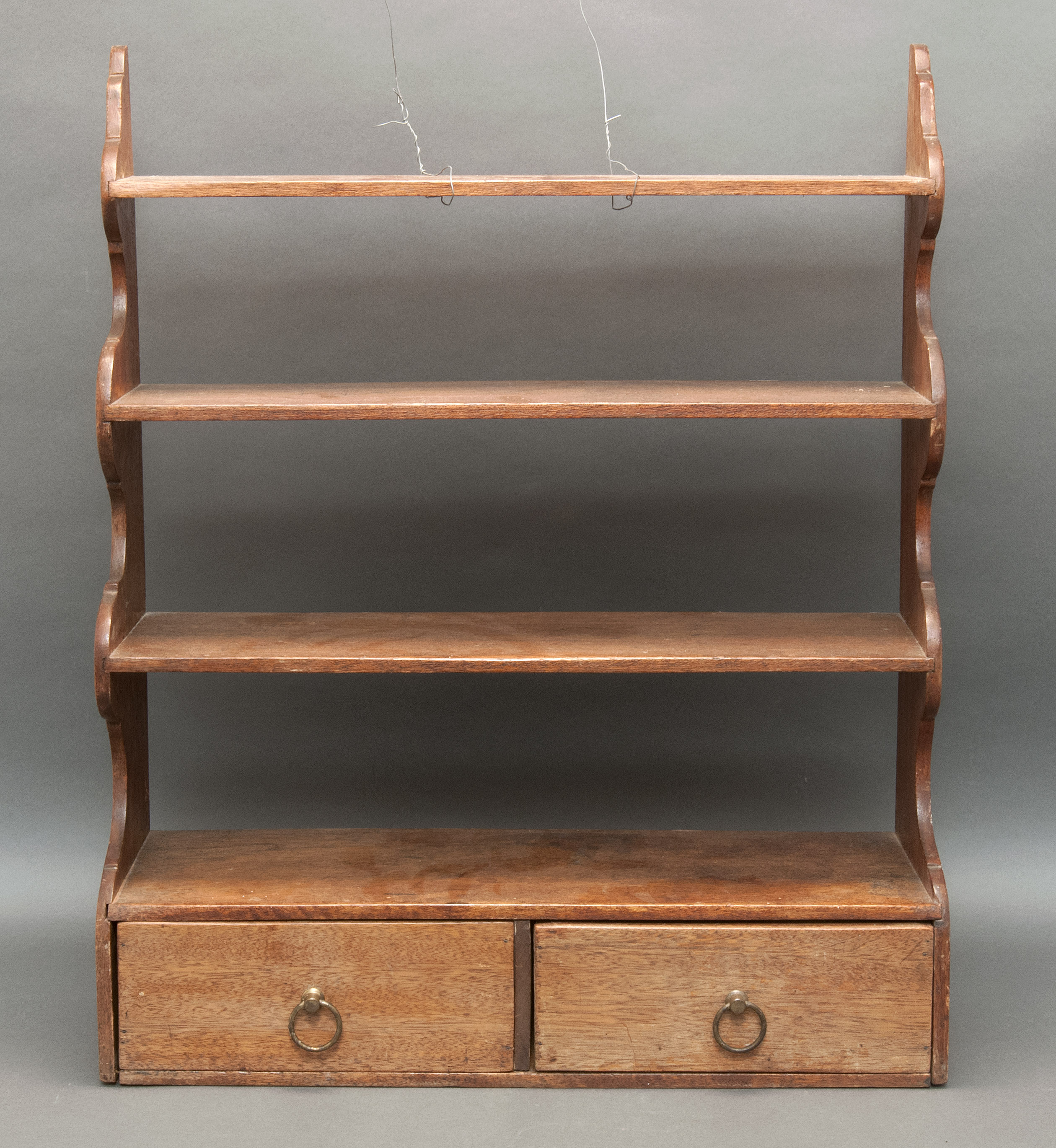 Appraisal: WAVE-SIDE SHELF Late th CenturyIn walnut with three shelves over