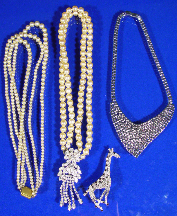 Appraisal: Stylish diamante necklace giraffe brooch and two simulated pearl necklaces