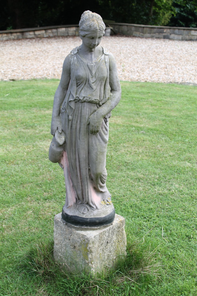 Appraisal: A modern garden figure of a Neo-Classical female water carrier