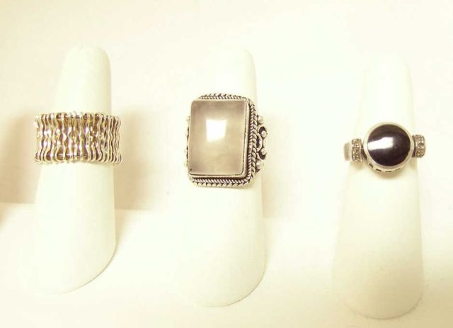 Appraisal: Three silver rings including two set with semi-precious stones including