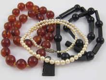 Appraisal: A mixed lot comprising an amber necklace a jet necklace