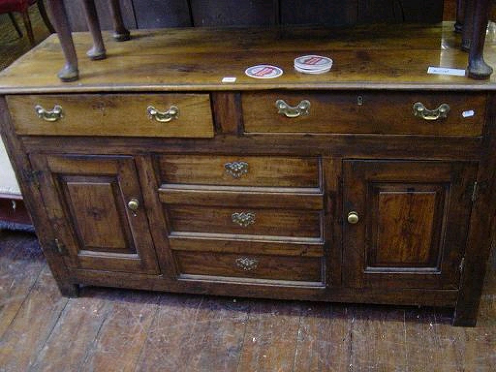 Appraisal: A Georgian oak dresser base fitted with two frieze drawers