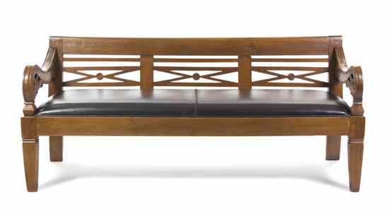 Appraisal: A Carved Oak and Leather Upholstered Hall Bench having a