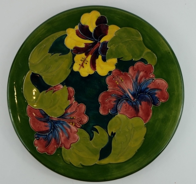 Appraisal: Moorcroft charger decorated in the hibiscus design on green signed