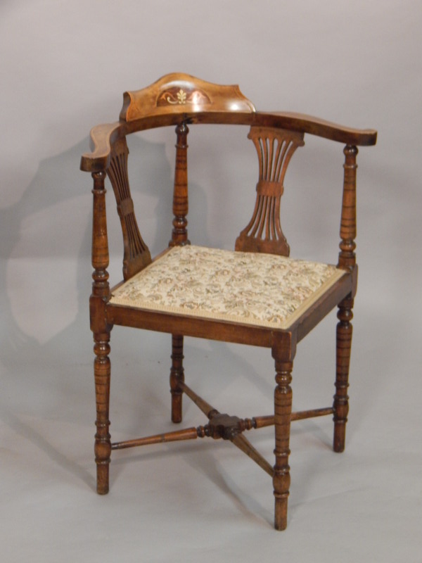 Appraisal: An Edwardian mahogany and marquetry corner chair with two pierced