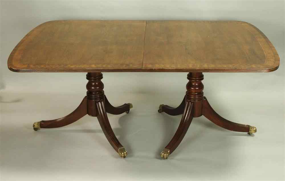 Appraisal: HENREDON MAHOGANY DOUBLE PEDESTAL DINING TABLE having a rectangular top