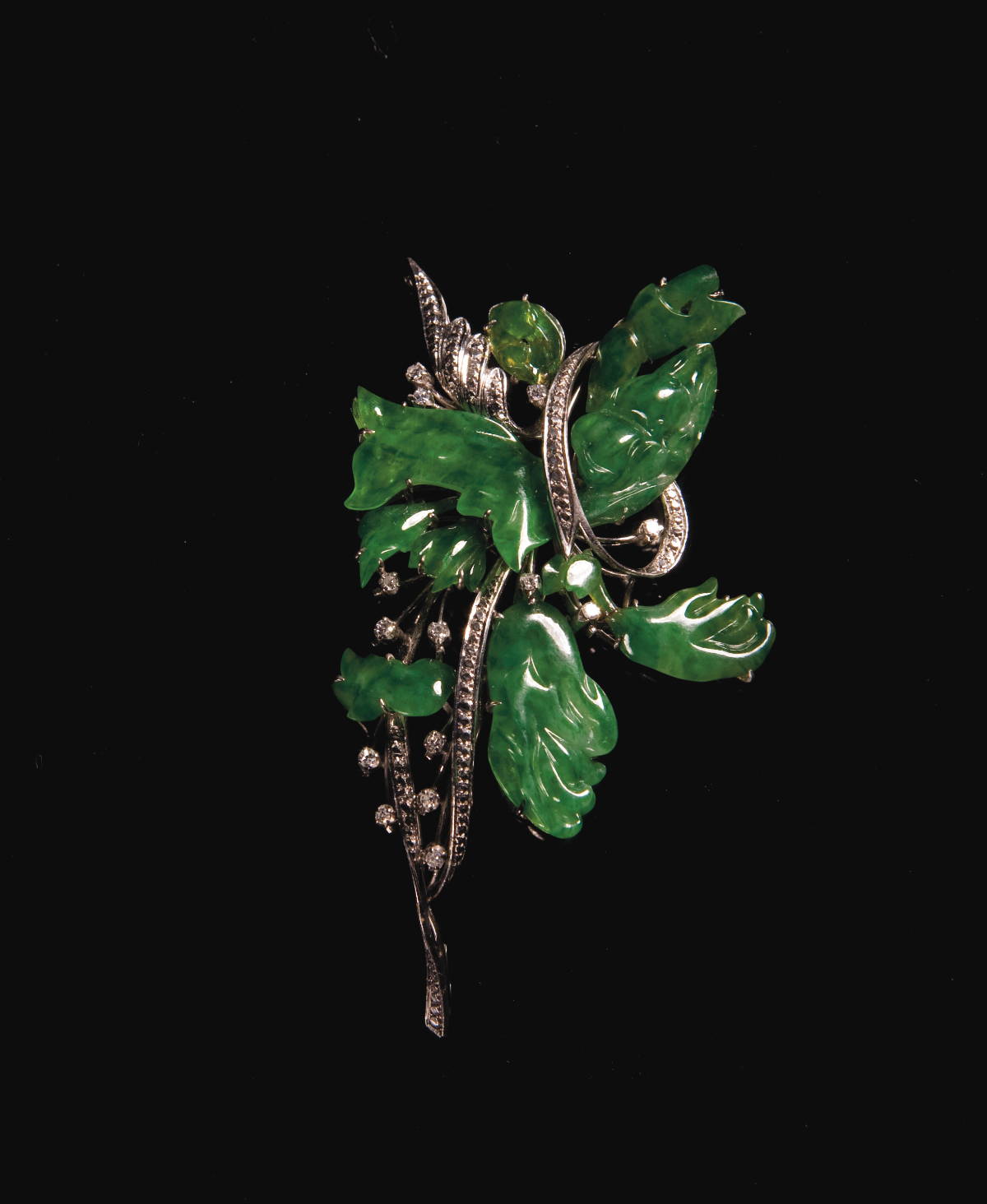 Appraisal: CARVED JADE AND DIAMOND FLORAL SPRAY BROOCH STAMPED K Together