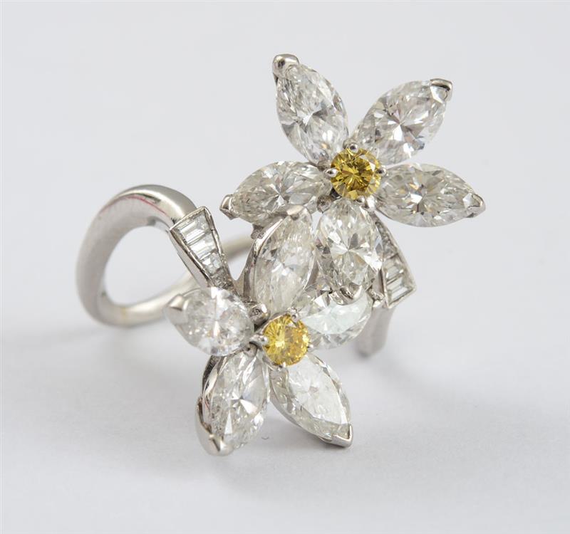 Appraisal: PLATINUM AND DIAMOND RING Double flowerheads with marquise-shaped diamond weighing