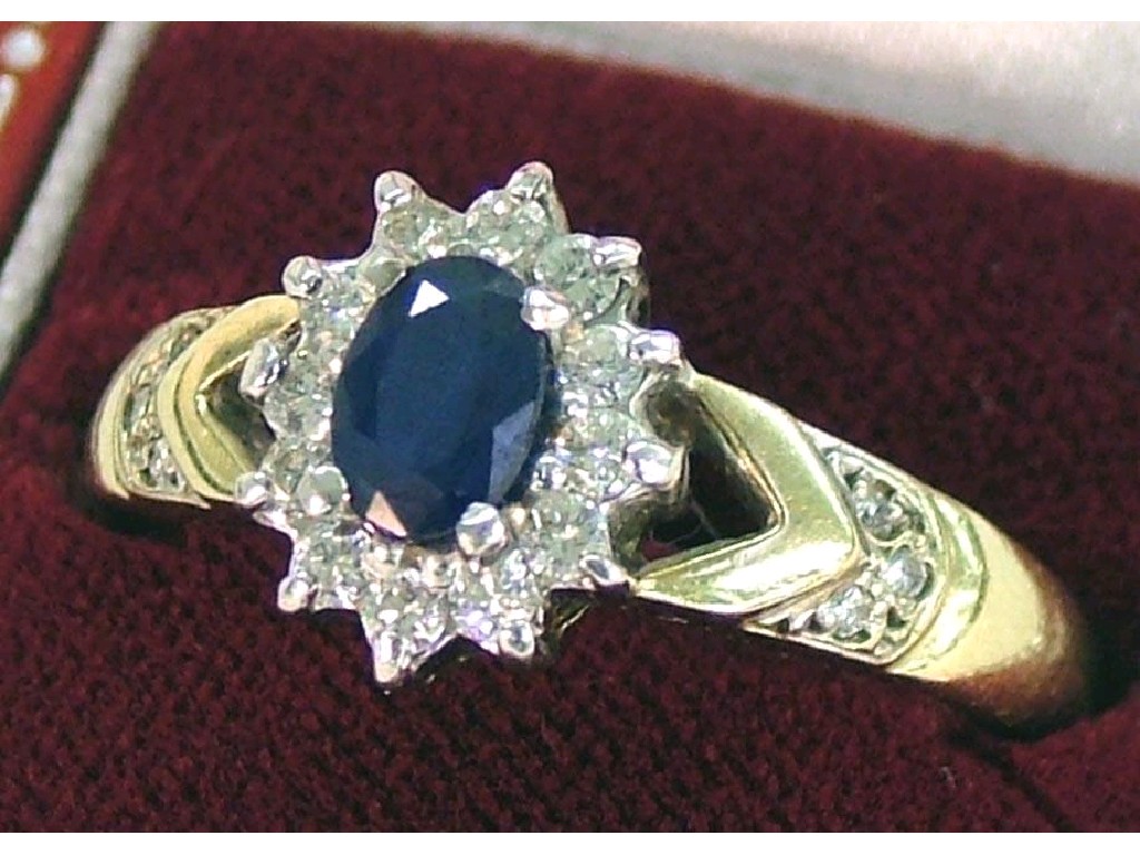 Appraisal: ct oval sapphire cluster ring set with a band of