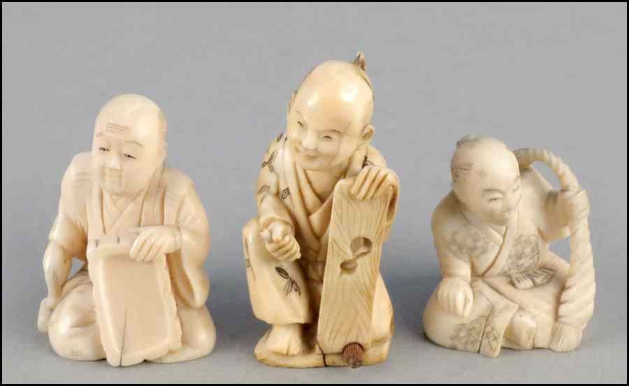 Appraisal: THREE CARVED IVORY SEATED FIGURES Tallest '' Condition No Specific