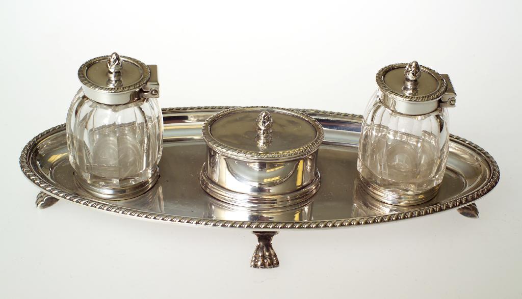 Appraisal: EDWARDIAN SILVER-PLATED DESK STAND in th century style the oval