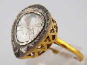 Appraisal: A yellow metal tests carat gold flat cut diamond ring