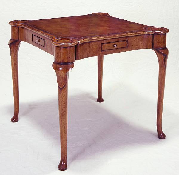 Appraisal: A Queen Anne style walnut games table The shaped top