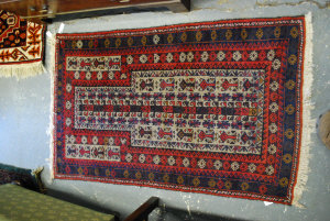 Appraisal: Afghan Belouch rug red ground cm x cm