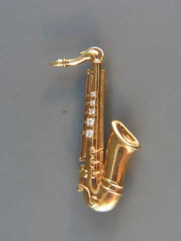 Appraisal: k Gold Saxaphone Figural Brooch diamonds grams