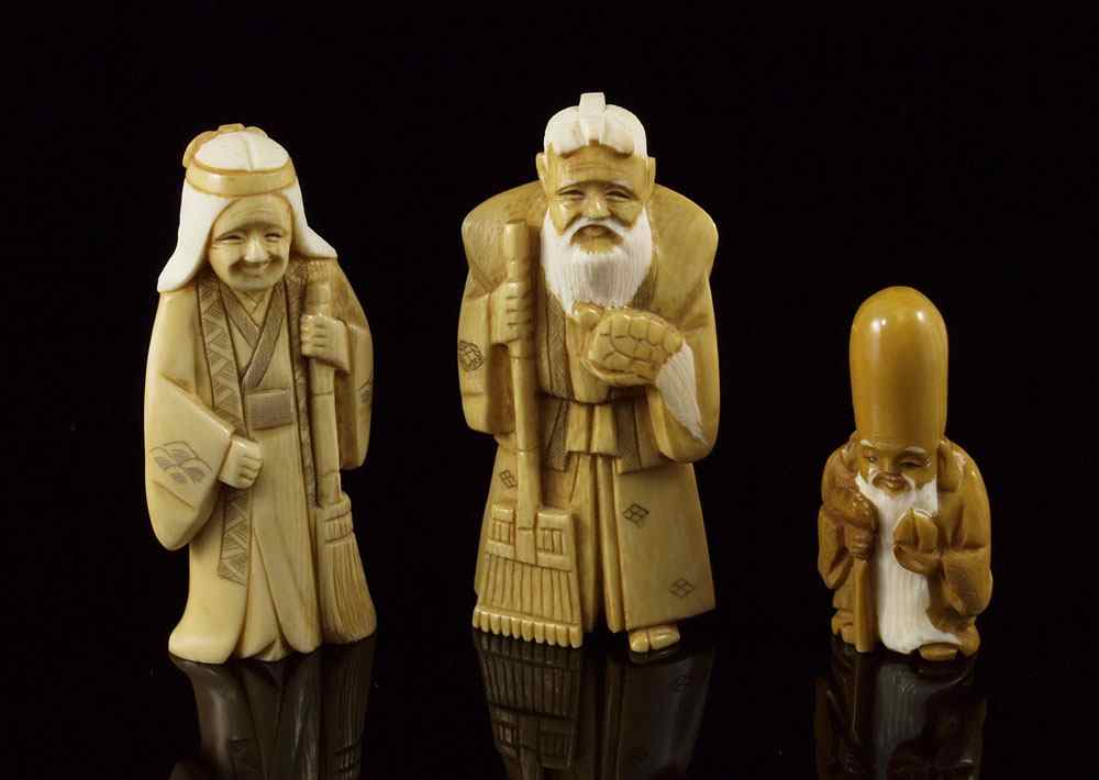 Appraisal: PIECE CARVED IVORY FIGURAL OKIMONO To include Elder man with