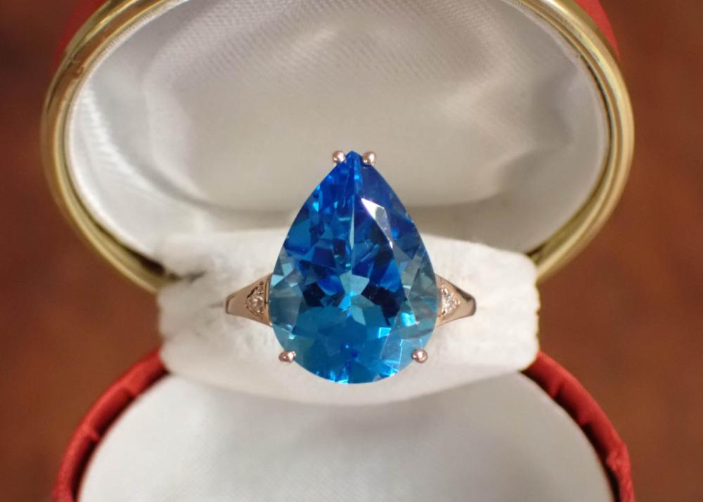 Appraisal: BLUE TOPAZ DIAMOND AND FOURTEEN KARAT ROSE GOLD RING having