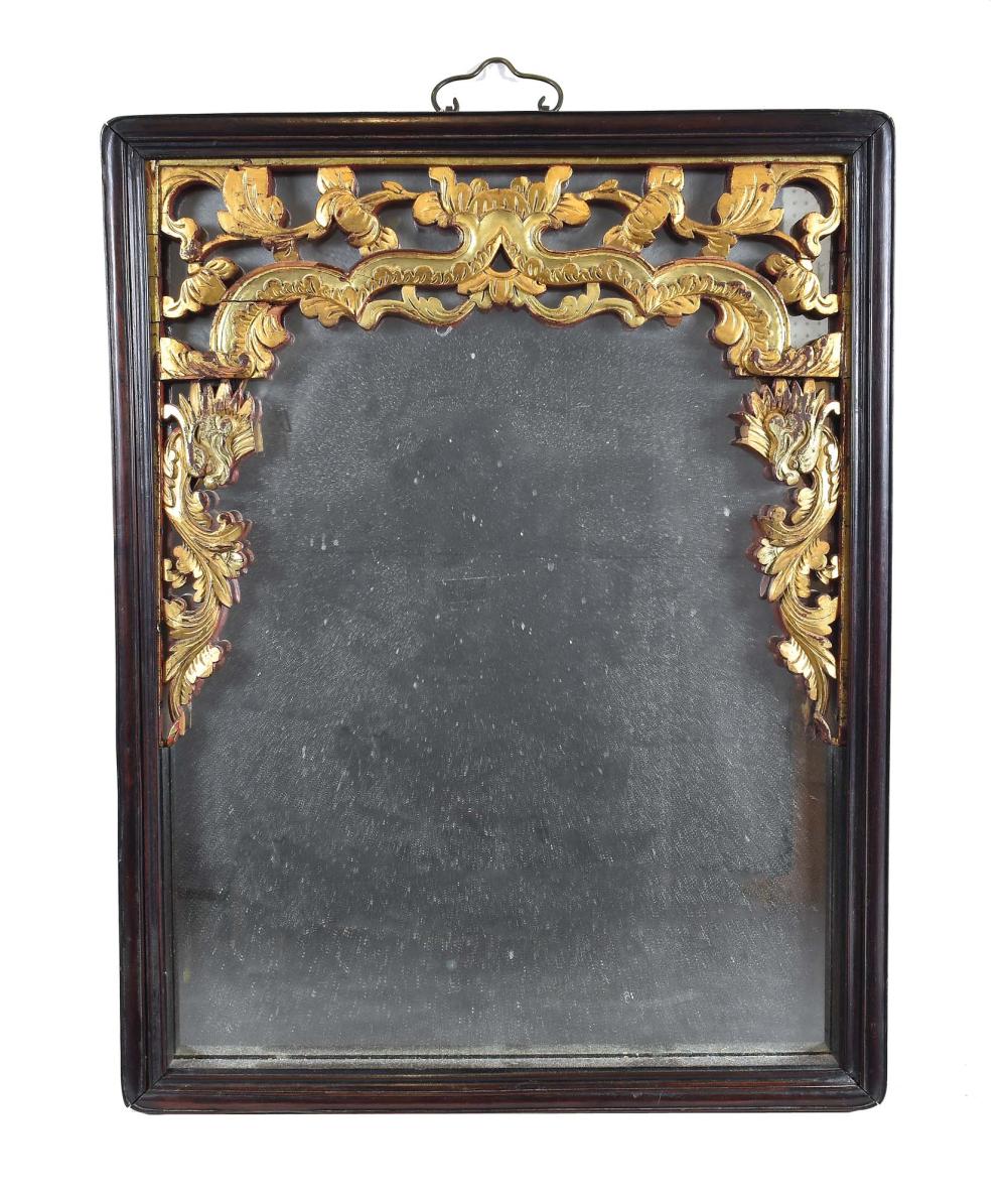 Appraisal: CHINESE PARCEL GILT HARDWOOD MIRRORThe rectangular plate beneath a parcel