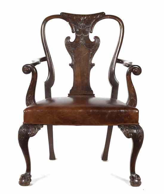 Appraisal: A Queen Anne Walnut Open Armchair having a carved crest